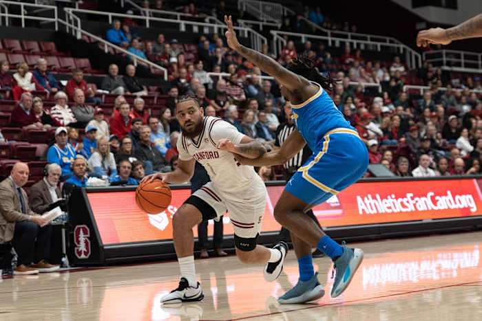 Feb 7, 2024; Stanford, California, USA; Stanford Cardinal guard Jared Bynum (1) drives the ball around UCLA Bruins guard Dylan Andrews (2) during the first half at Maples Pavilion. Mandatory Credit: Stan Szeto-USA TODAY Sports